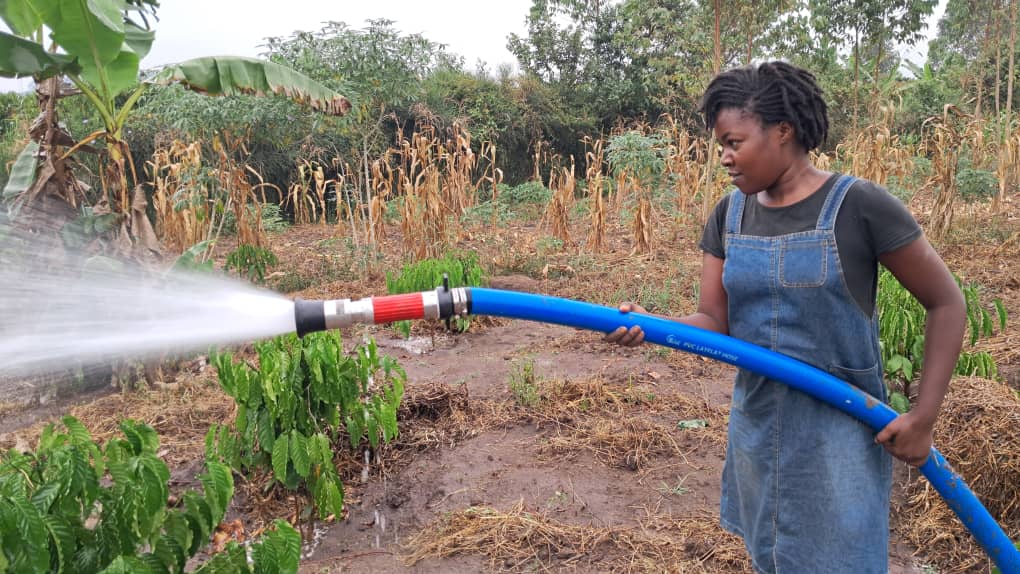 Community and students learning farming skills